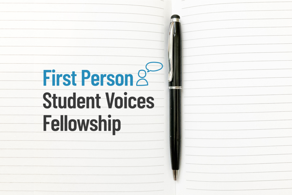 Pen and notebook with text overlaid reading "First Person Student Voices Fellowship"